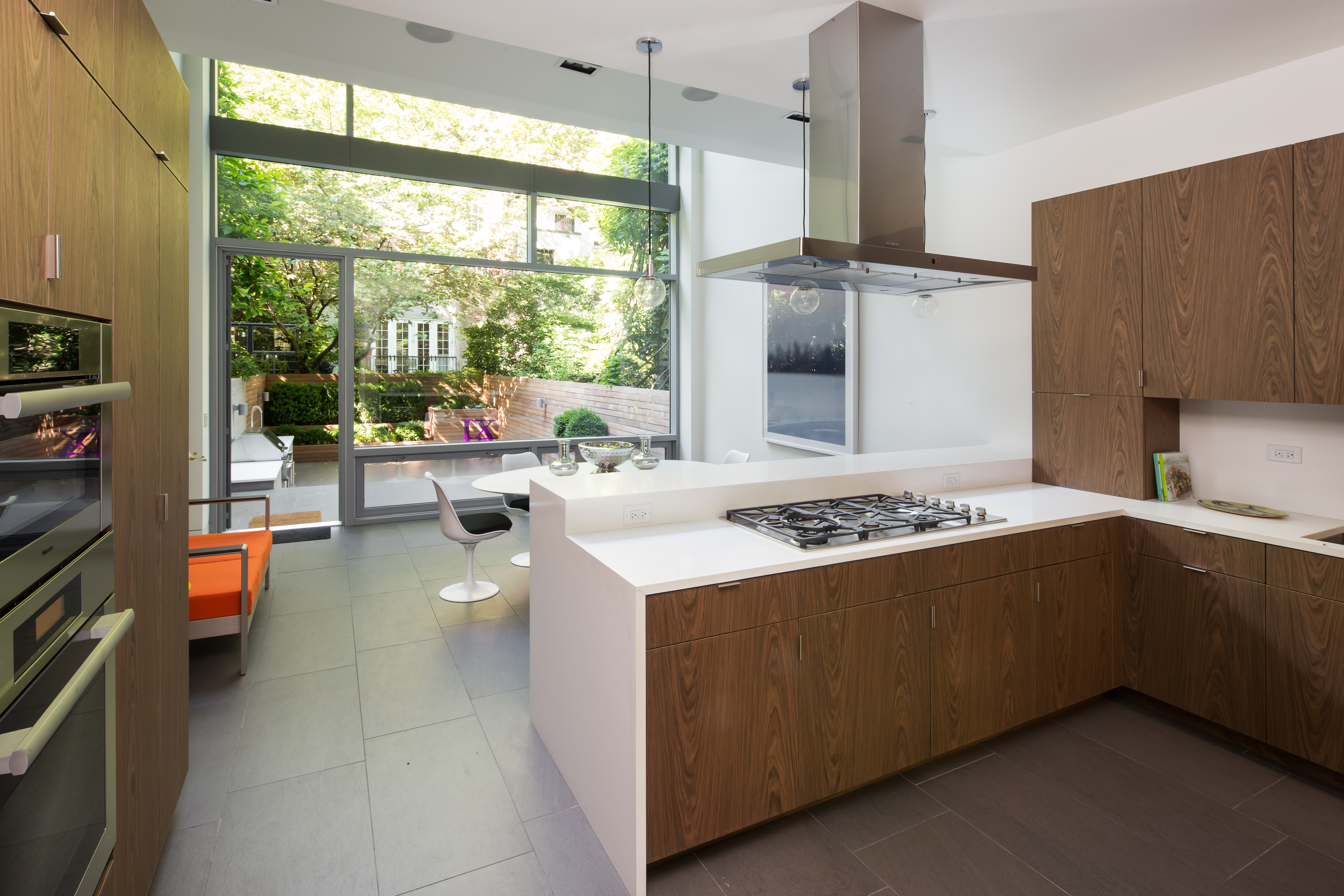 450 West 25th Street Manhattan, NY 10001 - Photo 4 of 16 a kitchen with a stove and a refrigerator