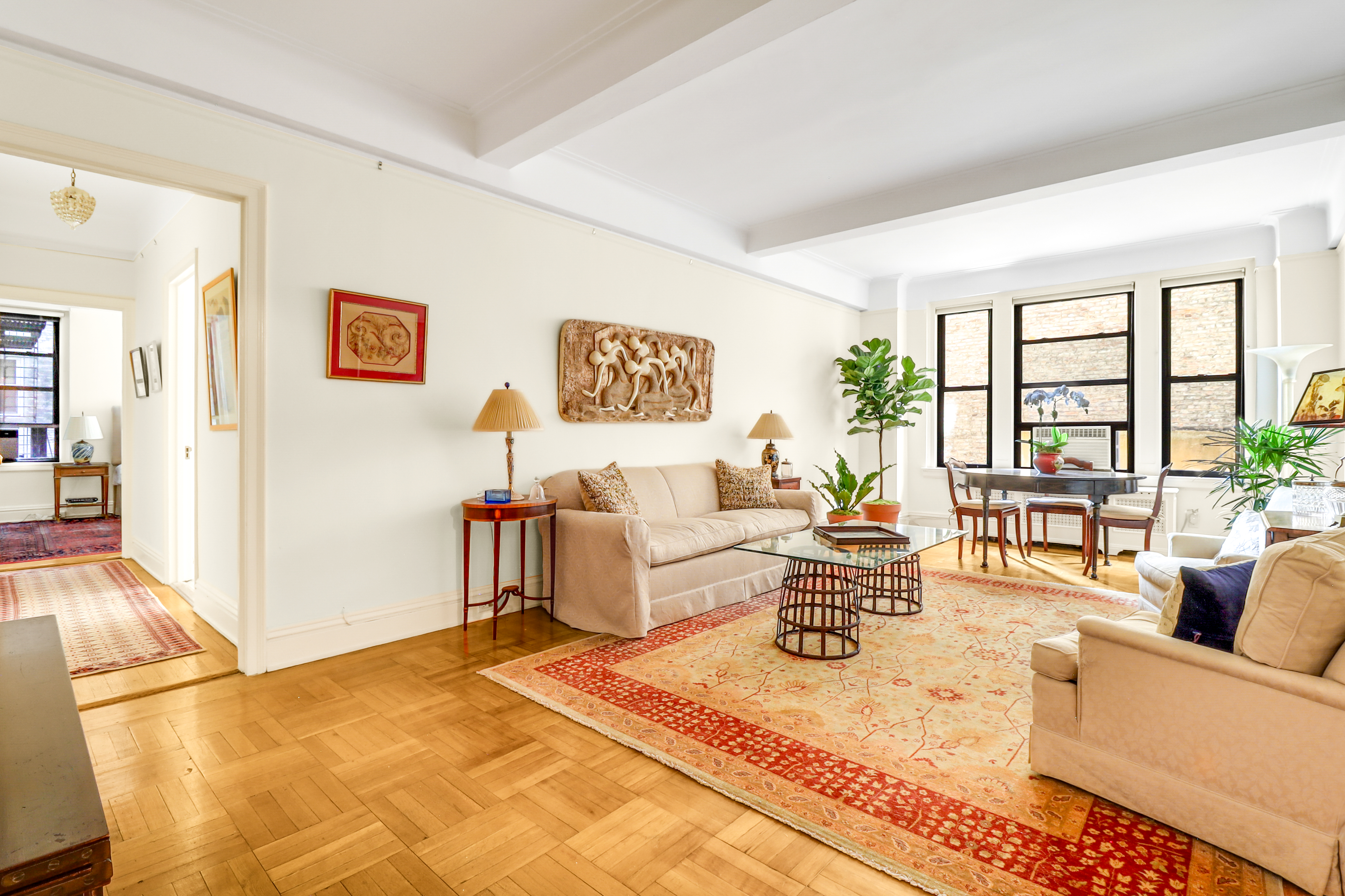 50 Riverside Drive, Unit 5E Manhattan, NY 10024 - Photo 2 of 22 a living room with furniture and a large window