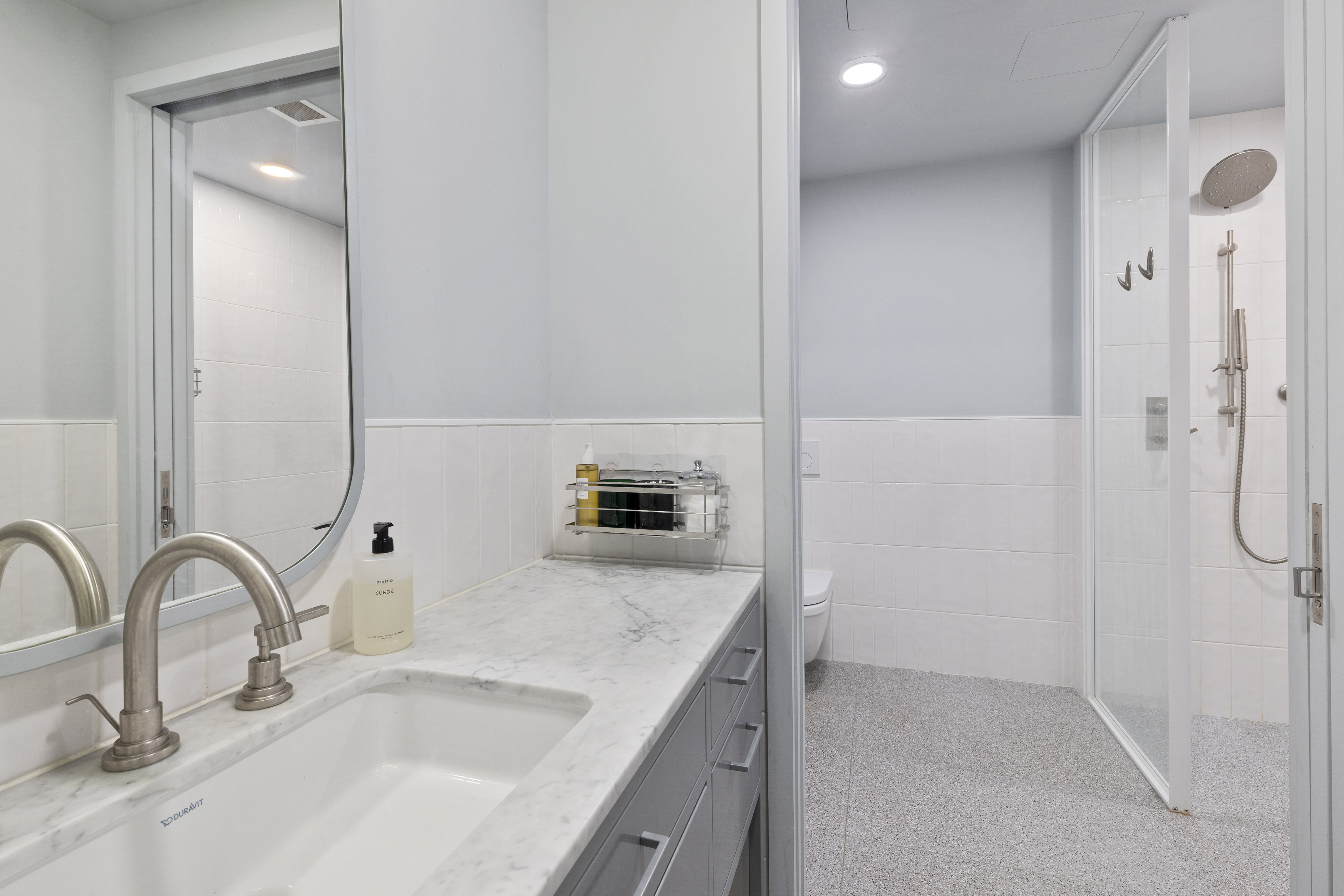 547 West 47th Street, Unit 807 Manhattan, NY 10036 - Photo 5 of 13 a bathroom with a sink and a mirror