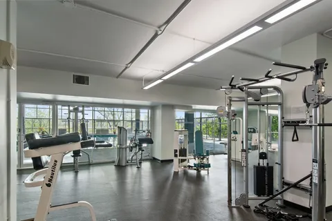 a view of a livingroom with couch and a large window