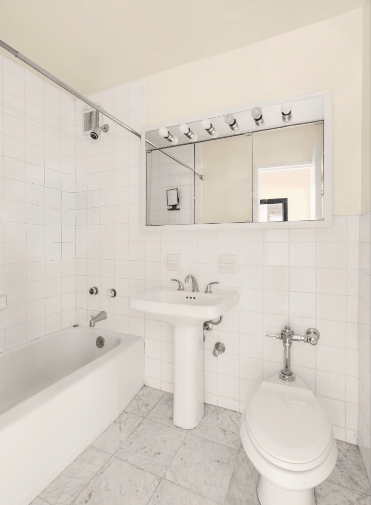 155 East 38th Street, Unit 5G Manhattan, NY 10016 - Photo 6 of 7 a bathroom with a sink toilet and shower