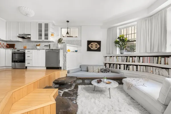 a living room with furniture and a window
