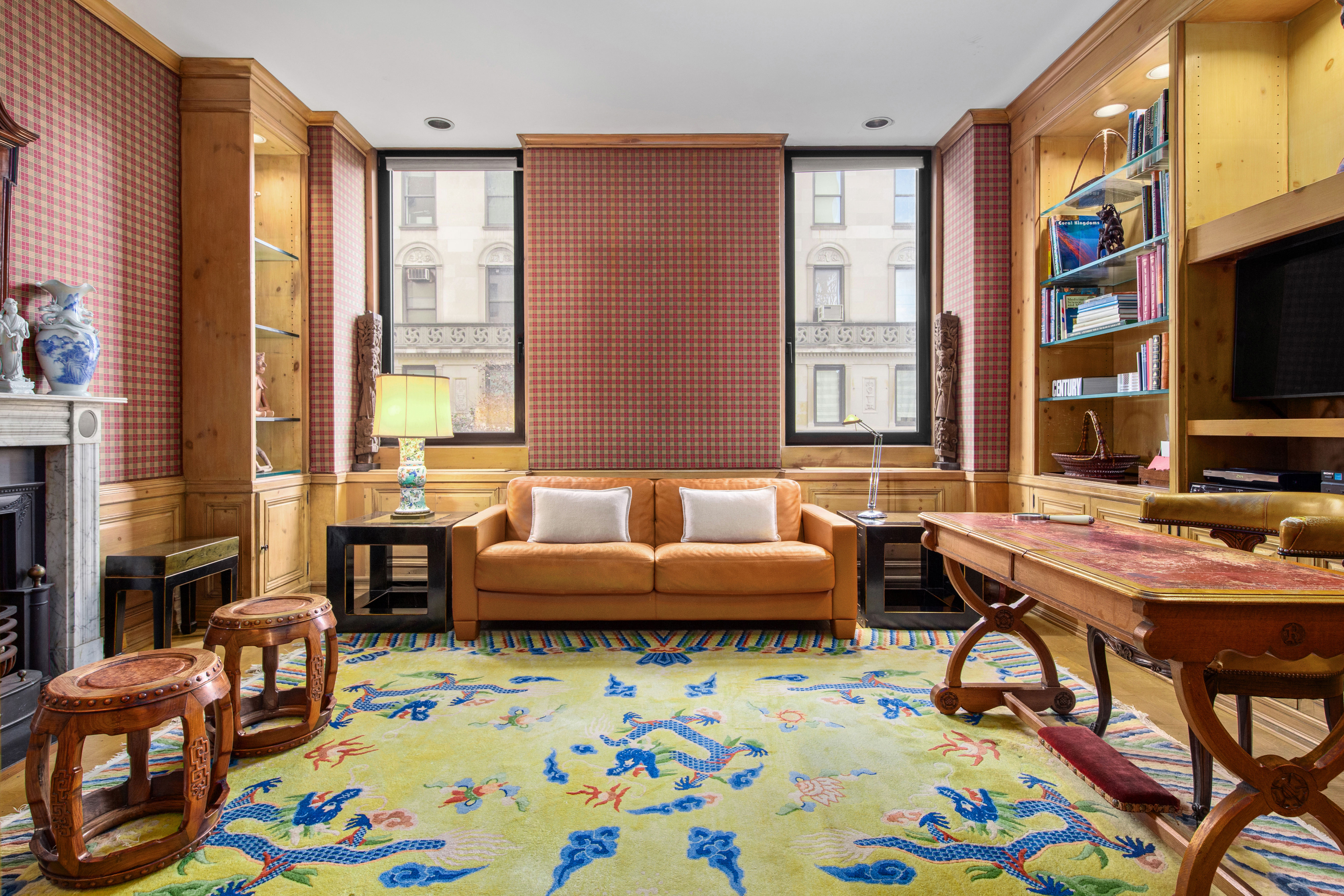 990 5th Avenue, Unit 4/5 Manhattan, NY 10075 - Photo 6 of 18 a view of a livingroom with furniture and a flat screen tv