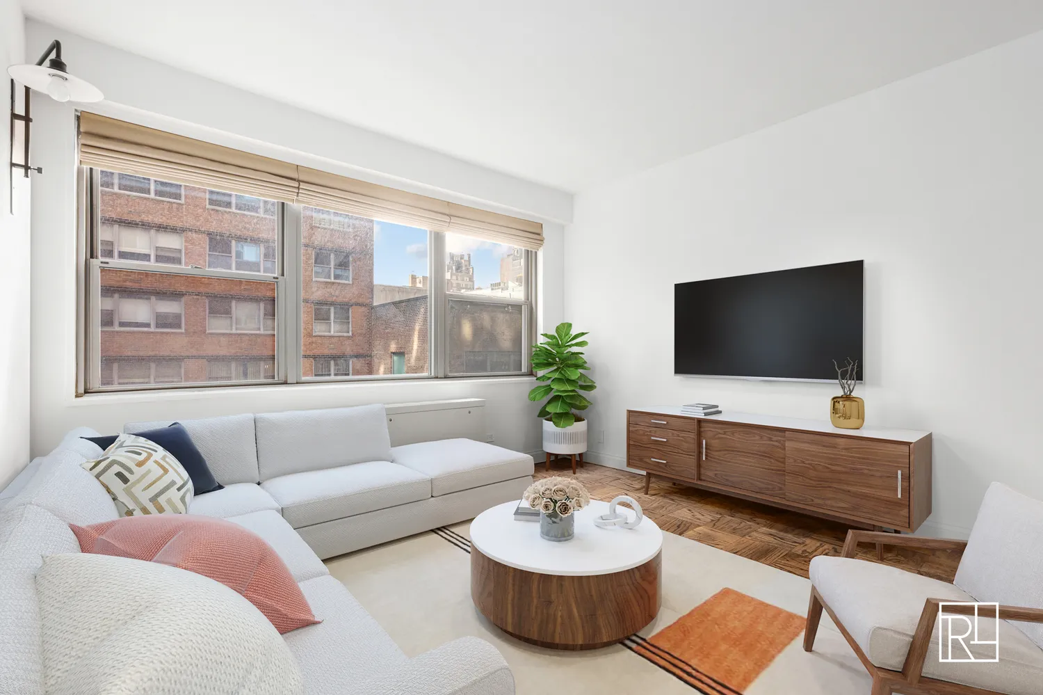 a living room with furniture and a flat screen tv