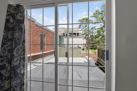 a room with sliding glass door