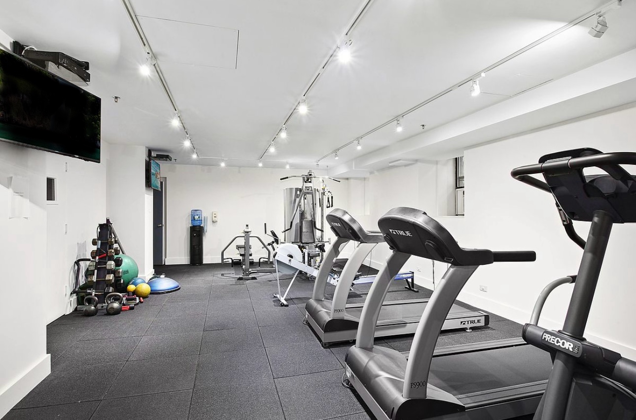 210 East 73rd Street, Unit 9EF Manhattan, NY 10021 - Photo 14 of 16 a view of a room with gym equipment