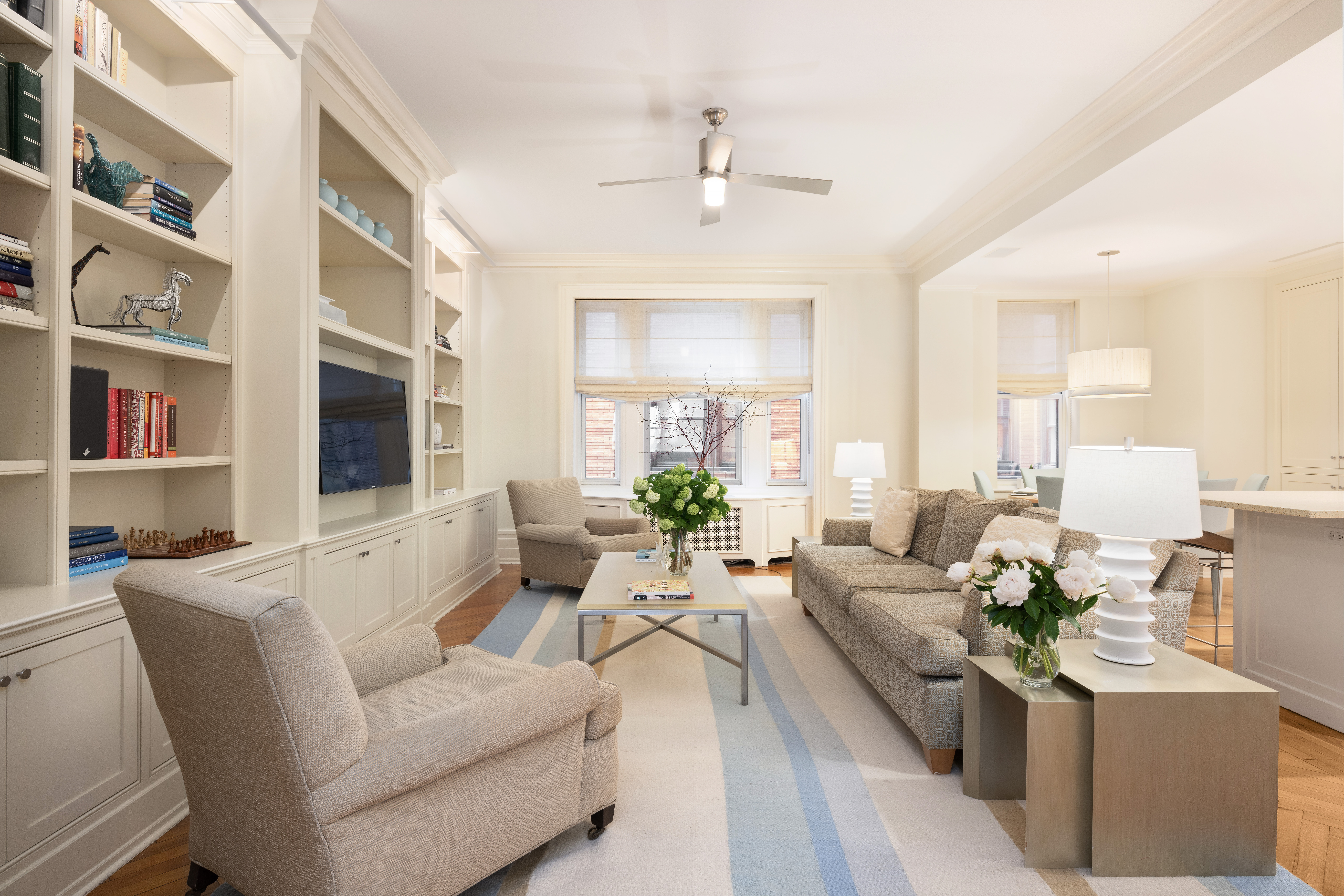 325 West End Avenue, Unit 6AB Manhattan, NY 10023 - Photo 7 of 22 a living room with furniture and a chandelier