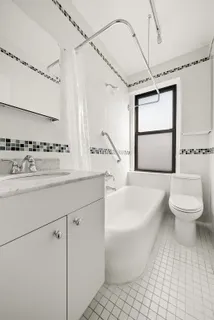 a bathroom with a sink a toilet and a bathtub