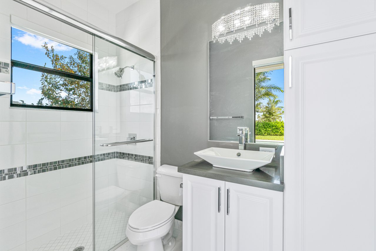 17352 Rosella Road Boca Raton, FL 33496 - Photo 13 of 41 a bathroom with a sink and a mirror