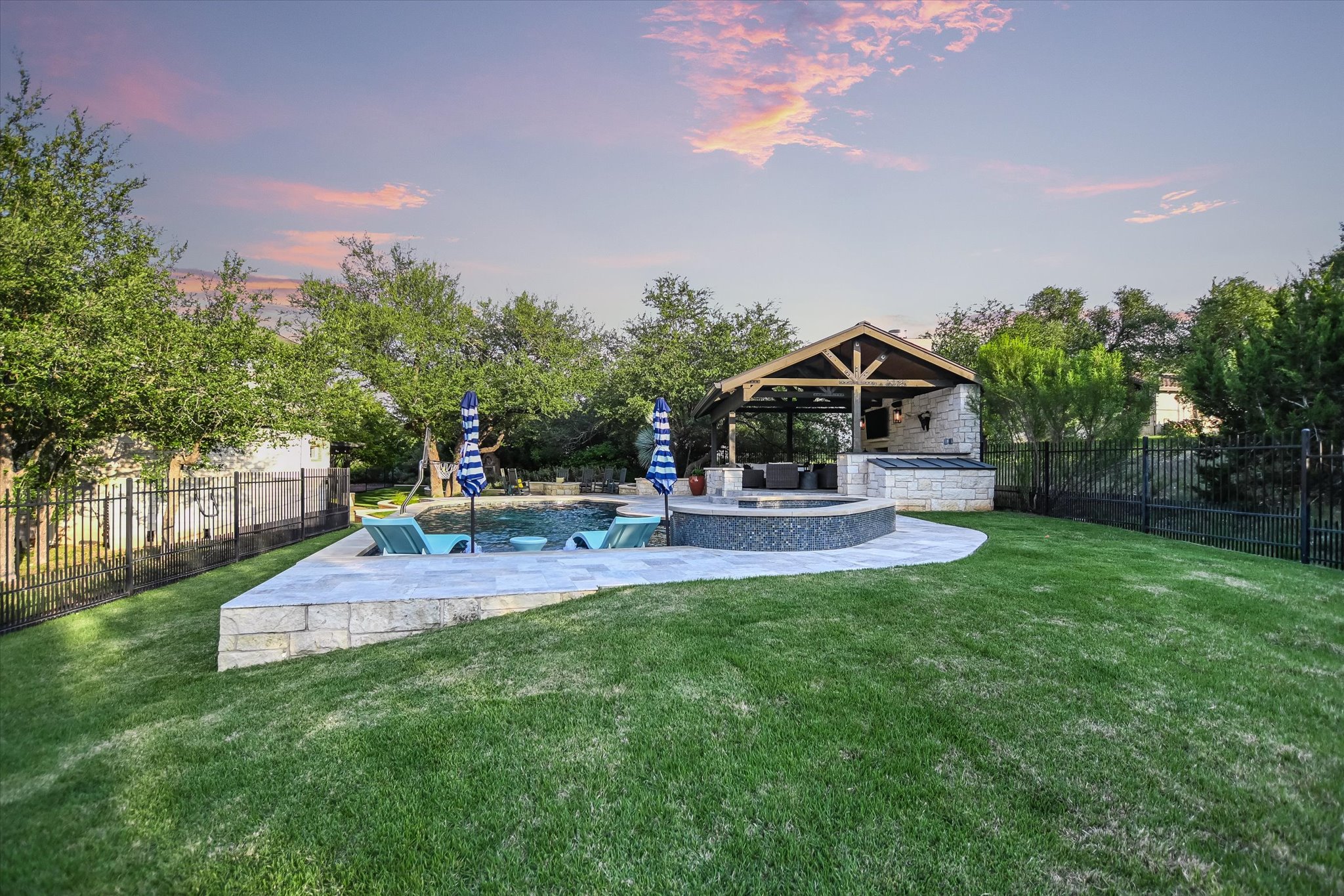 1422 Palomino Ridge Drive Austin, TX 78733 - Photo 52 of 60 a view of house with backyard and outdoor seating