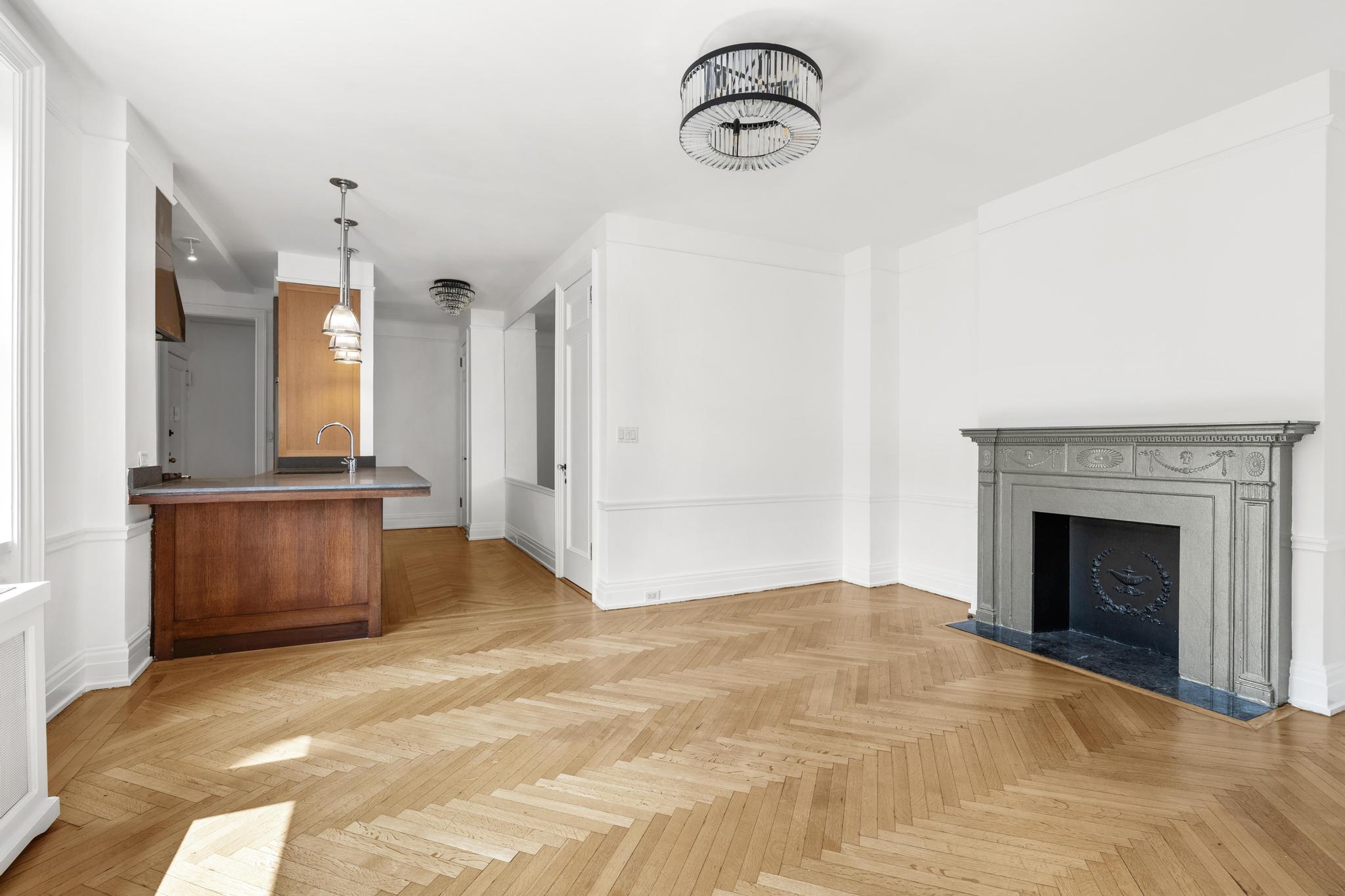 885 West End Avenue, Unit 12D Manhattan, NY 10025 - Photo 2 of 24 a view of a kitchen with a sink and a fireplace