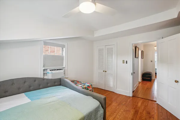a bedroom with a bed and a dresser