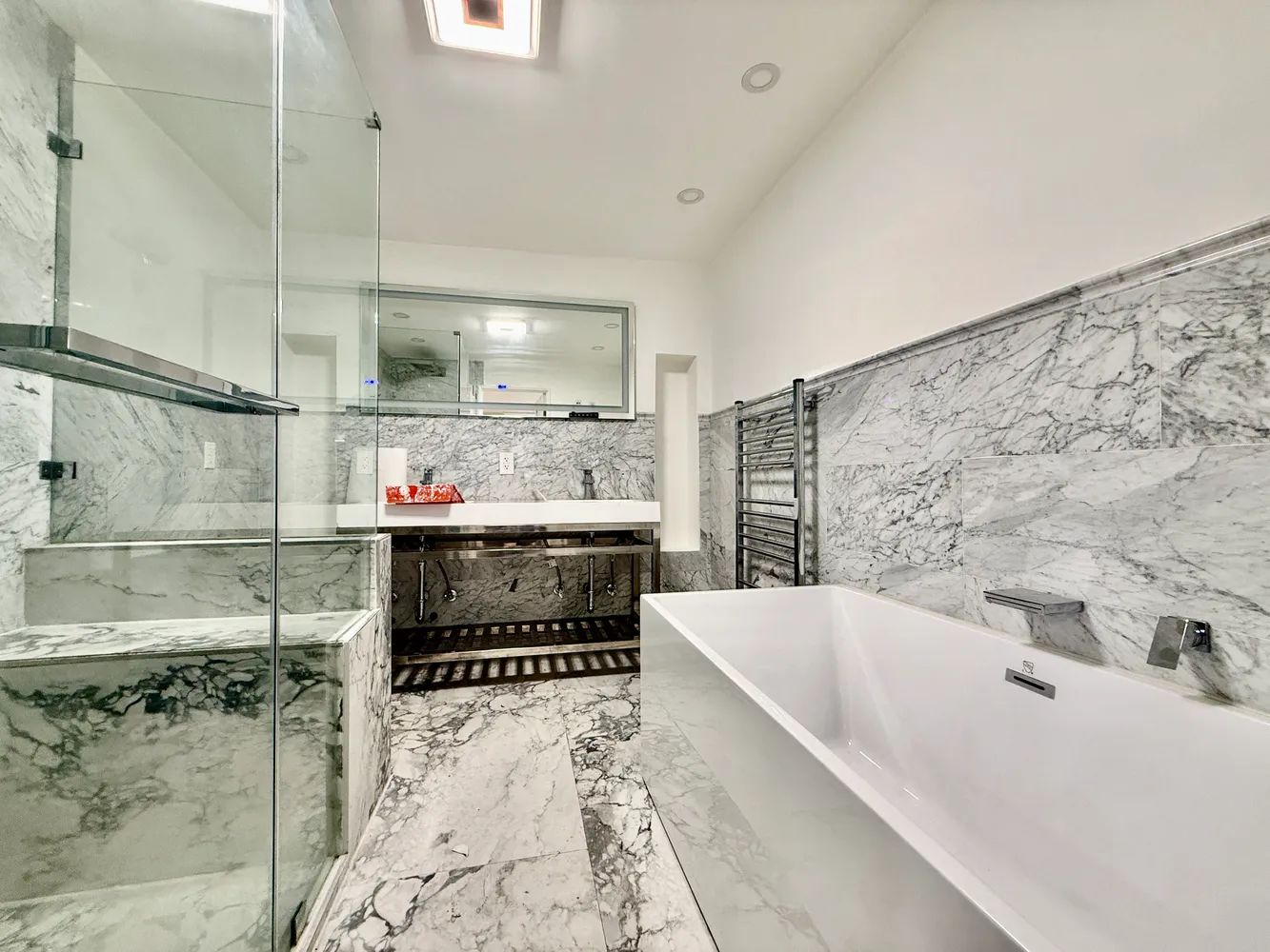 a bathroom with a bathtub and shower