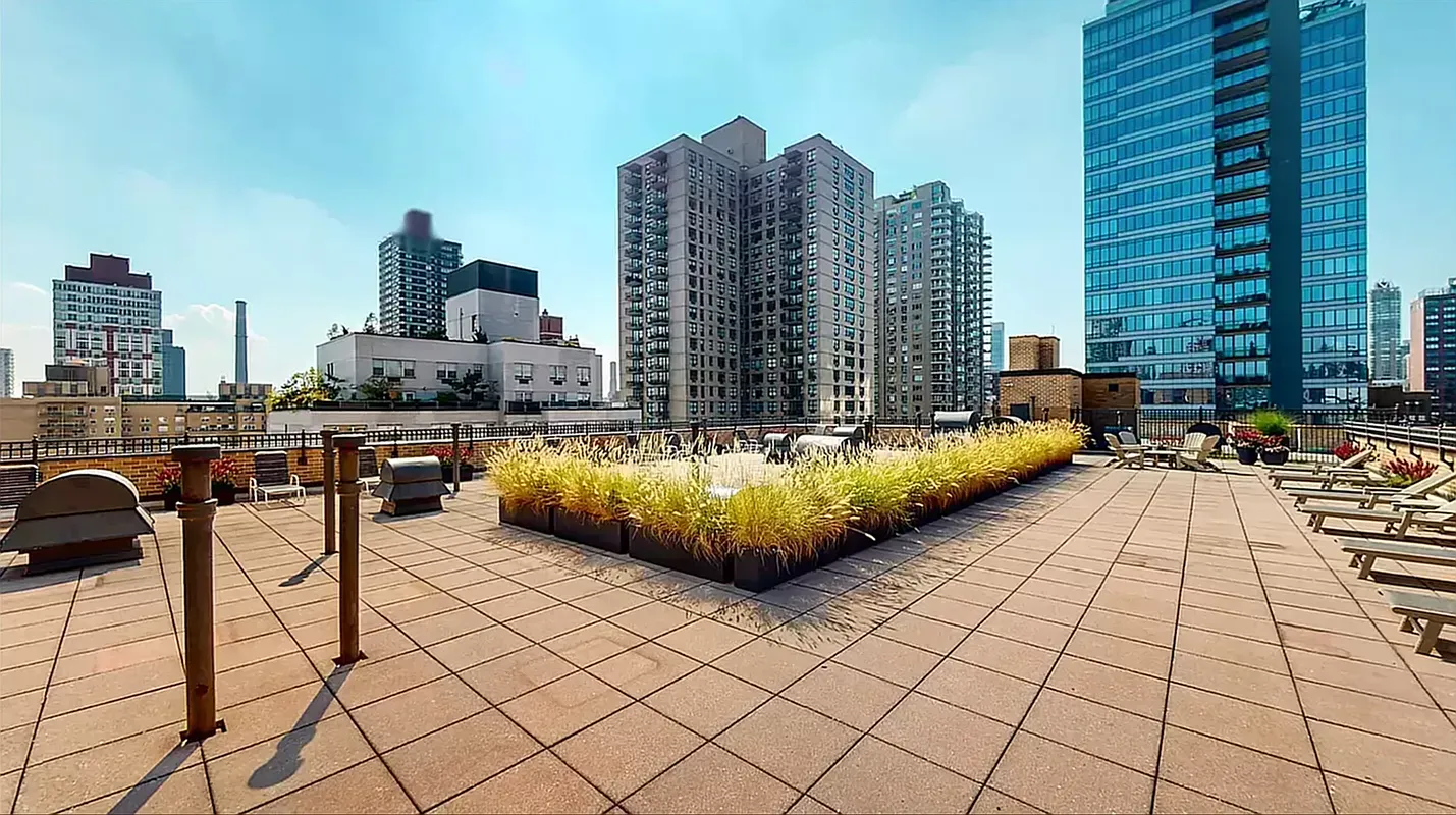 240 East 76th Street, Unit 2E Manhattan, NY 10021 - Photo 10 of 11 a view of roof deck with seating space and a oven
