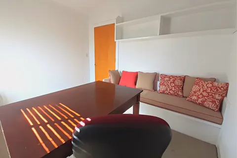 an empty room with a empty space and windows