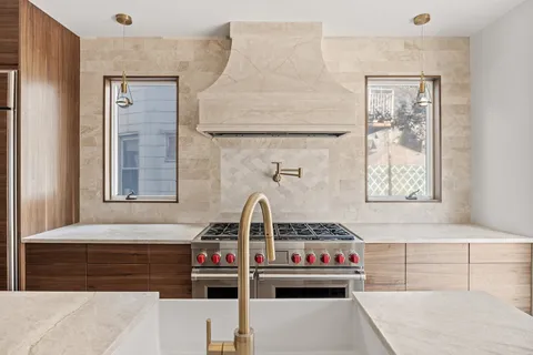 a kitchen with kitchen island cabinets and wooden floor