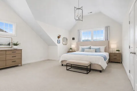a bed room with a bed and a window