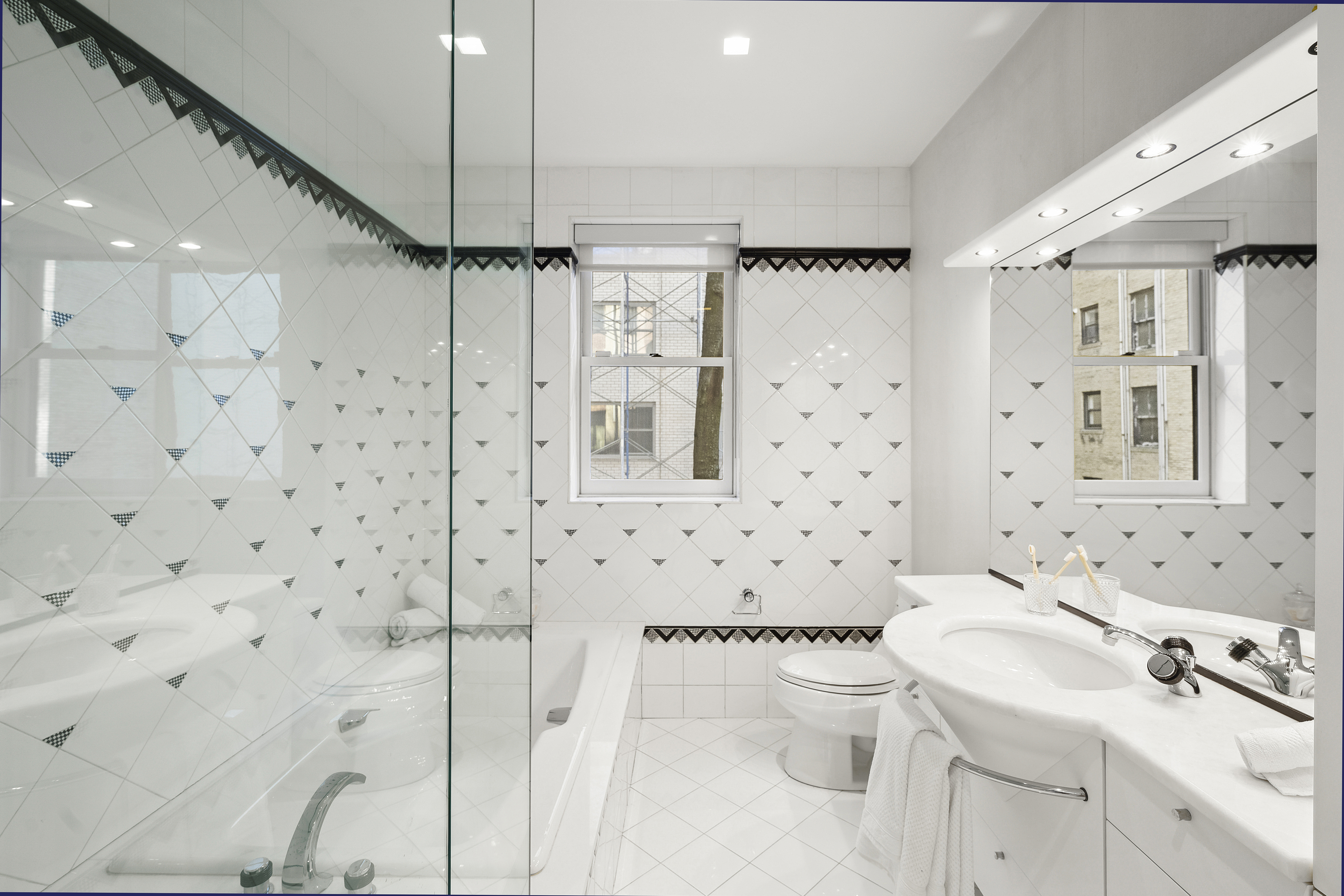 50 East 73rd Street Manhattan, NY 10021 - Photo 25 of 32 a bathroom with a sink toilet and shower