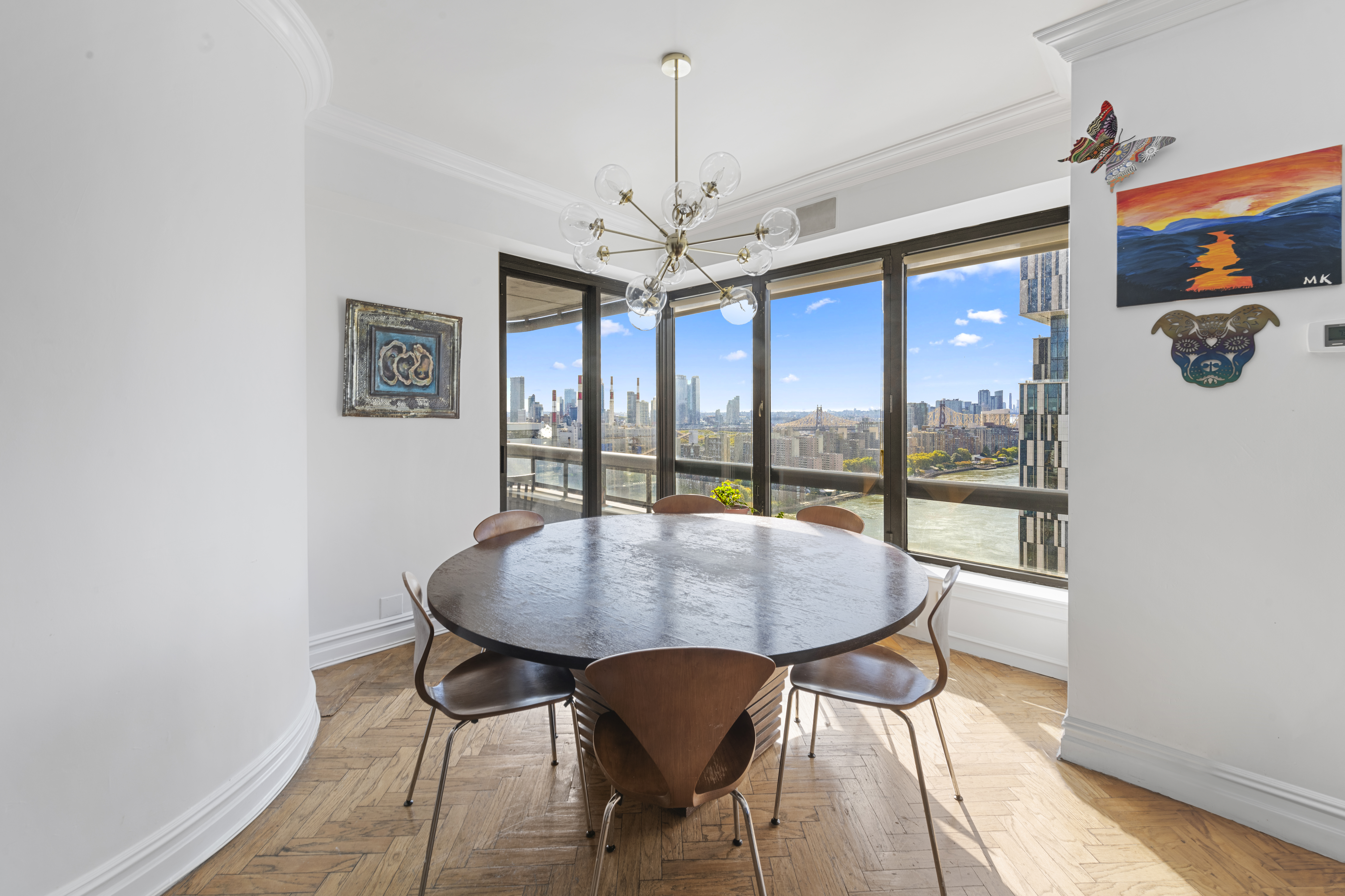530 East 76th Street Manhattan, NY 10021 - Photo 4 of 20 a dining room with furniture a chandelier and wooden floor