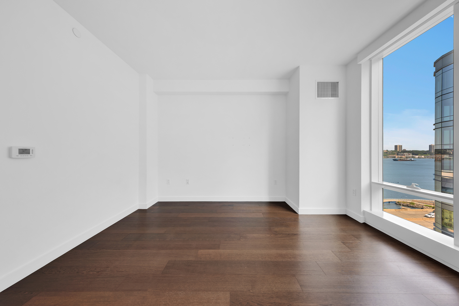 30 Riverside Boulevard, Unit 1414 Manhattan, NY 10069 - Photo 8 of 25 a view of a room with wooden floor and a window