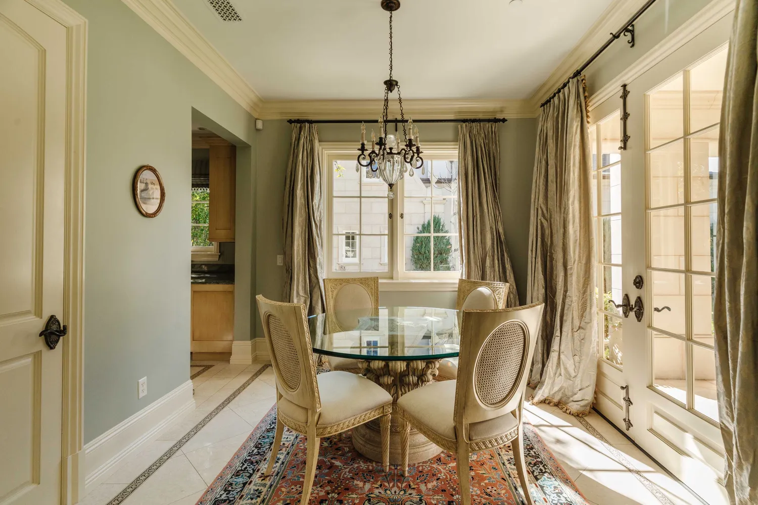 a dining room with furniture and a window