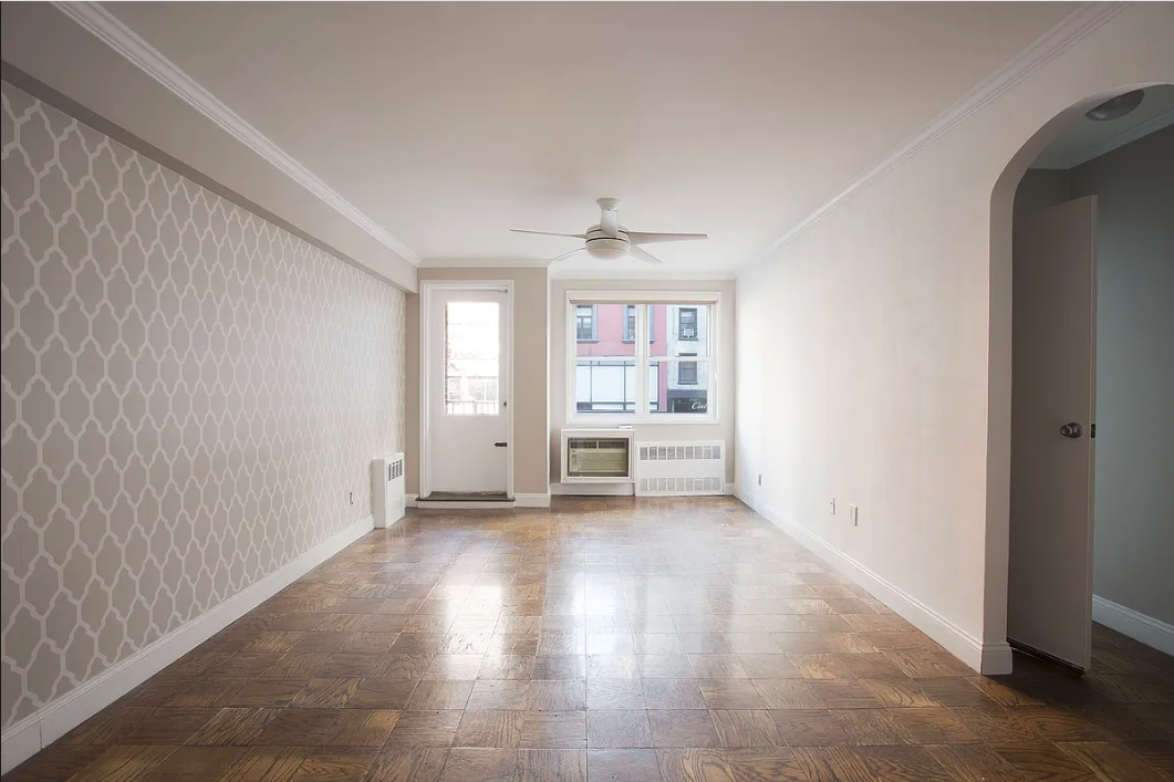 170 West 23rd Street, Unit 2F Manhattan, NY 10011 - Photo 2 of 10 an empty room with windows and furniture
