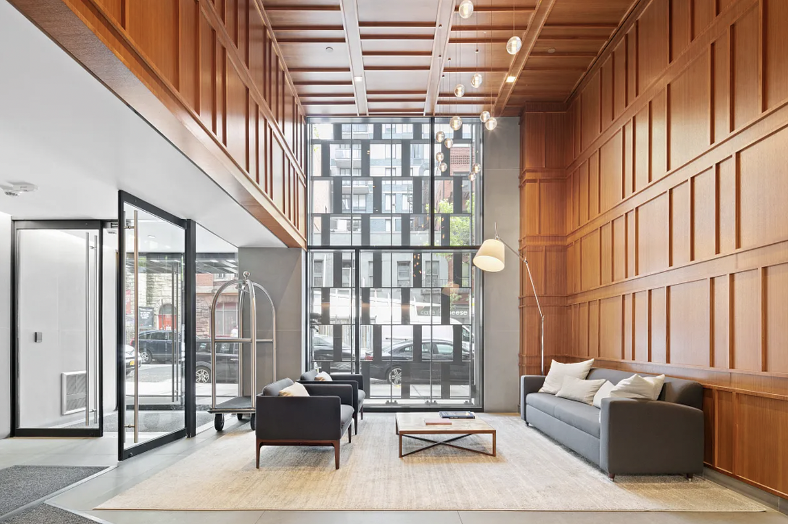 160 East 22nd Street, Unit 4D Manhattan, NY 10010 - Photo 13 of 15 a living room with furniture and a floor to ceiling window