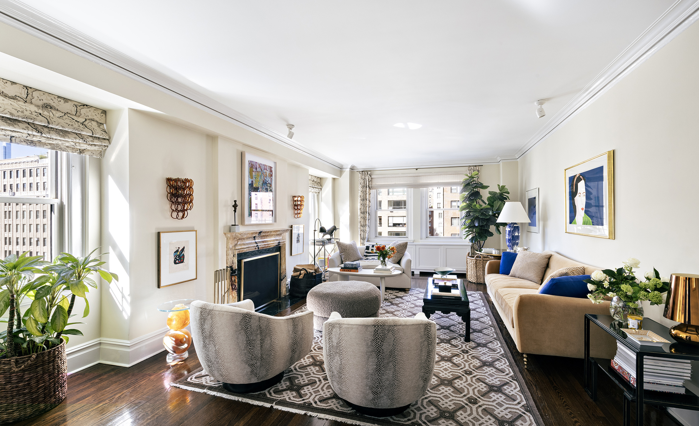 1035 Park Avenue, Unit 11B Manhattan, NY 10028 - Photo 1 of 13 a living room with fireplace furniture and a potted plant