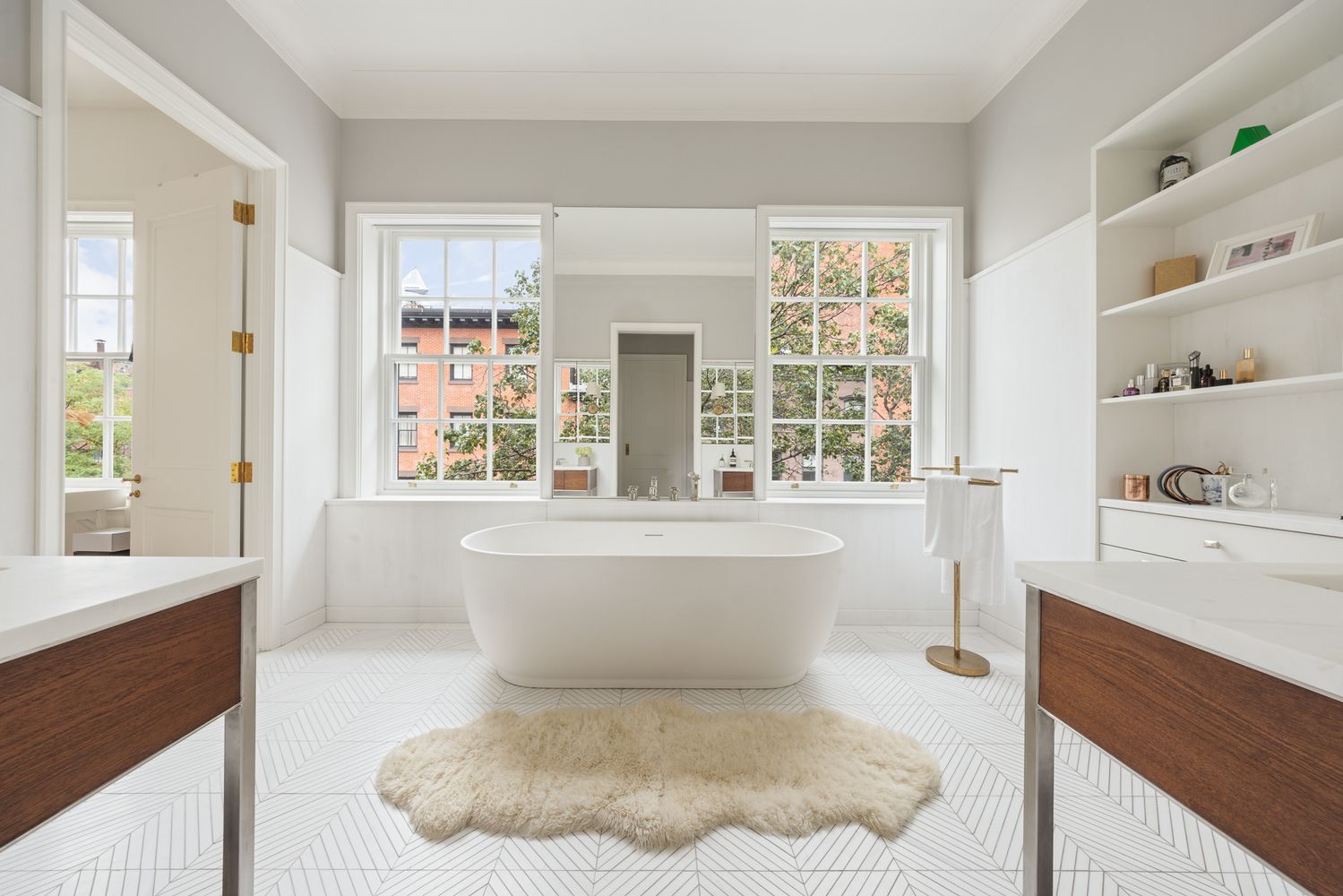 a bathroom with a bathtub sink and window