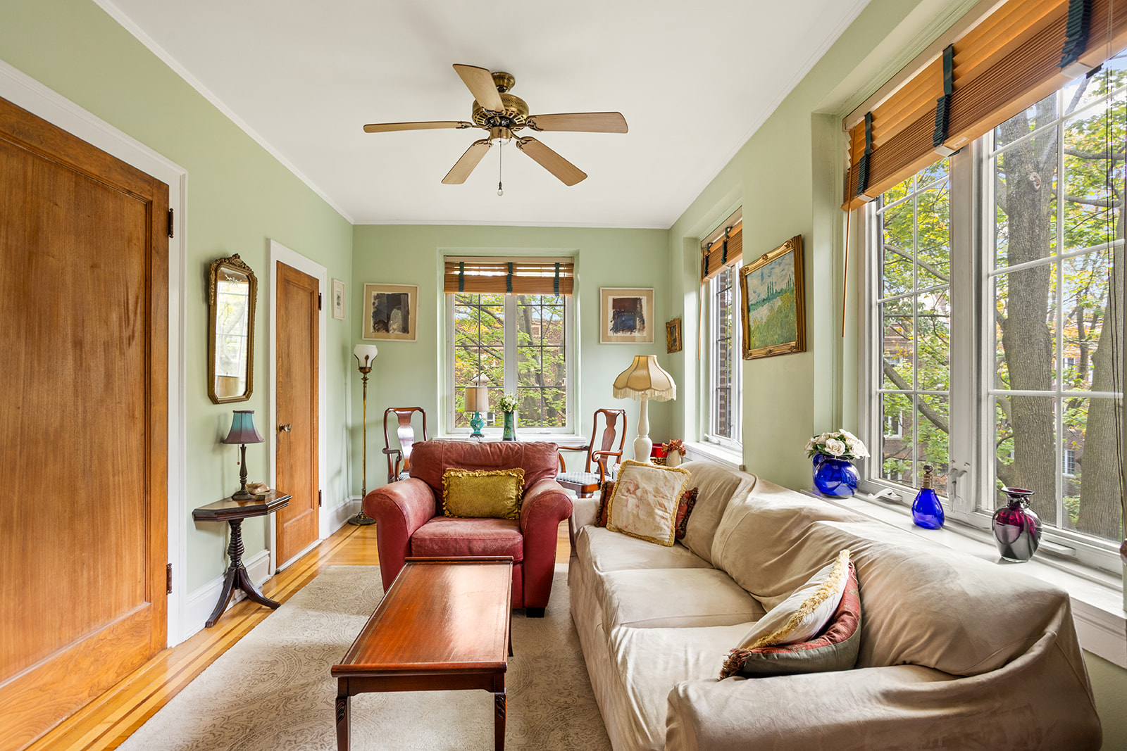 34-27 79th Street, Unit 42 Queens, NY 11372 - Photo 5 of 15 a living room with furniture and a large window