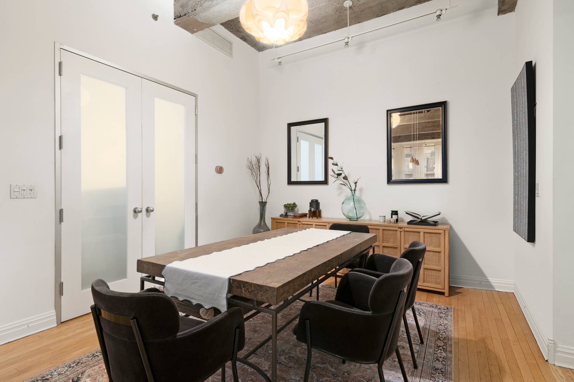 419 West 55th Street, Unit 2D Manhattan, NY 10019 - Photo 4 of 10 a view of a dining room with furniture and wooden floor