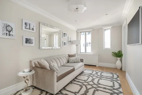 a living room with furniture and a rug