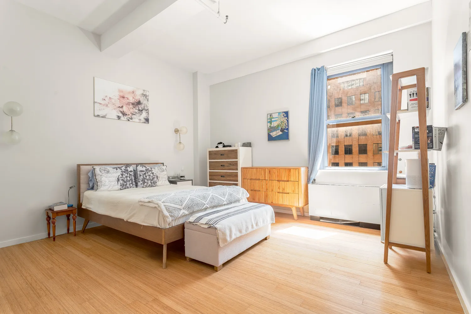 a bedroom with a large bed and a couch