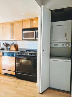 a stove top oven sitting inside of a kitchen