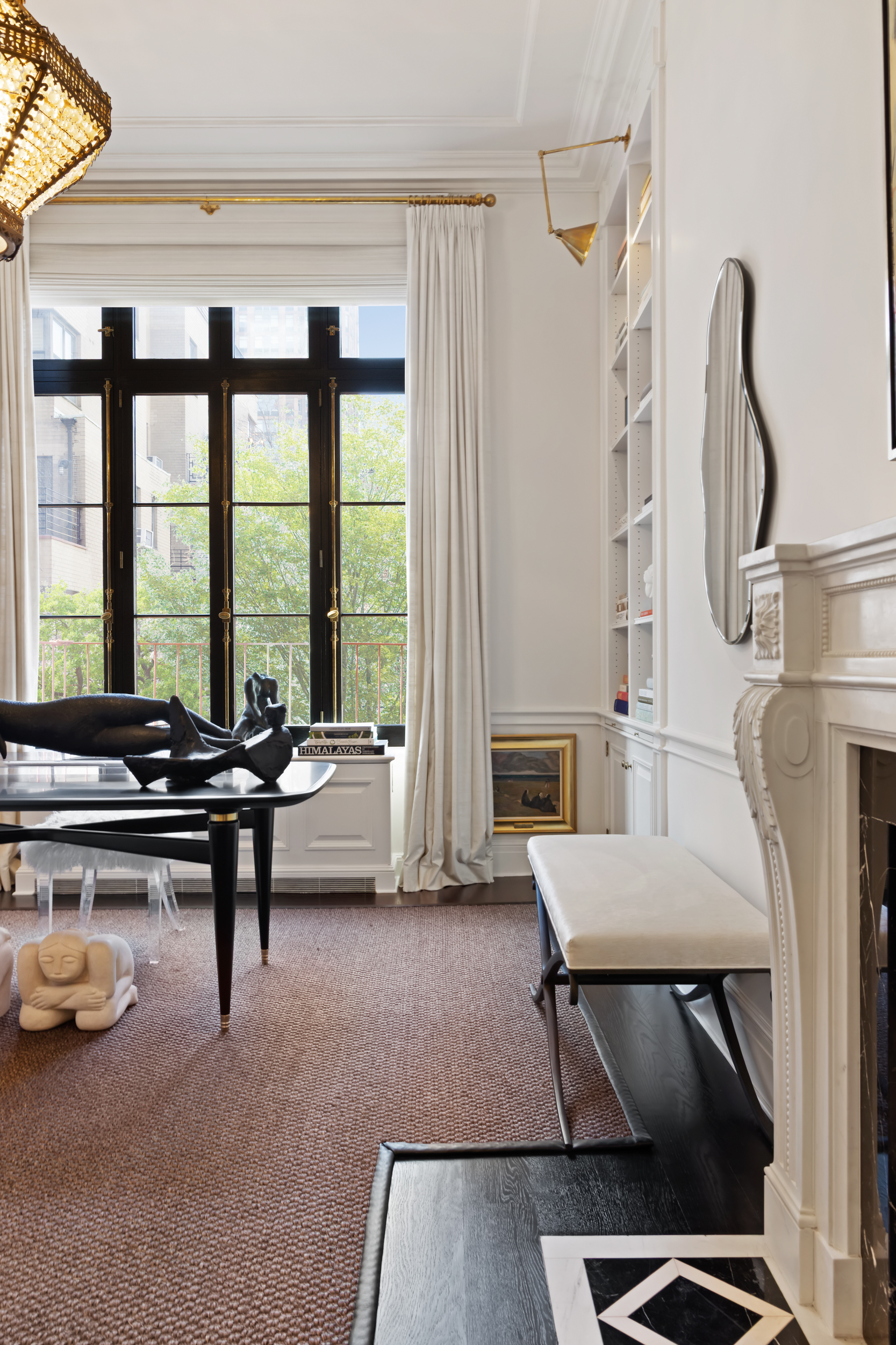 170 East 78th Street, Unit 8E Manhattan, NY 10075 - Photo 4 of 16 a living room with furniture and floor to ceiling windows