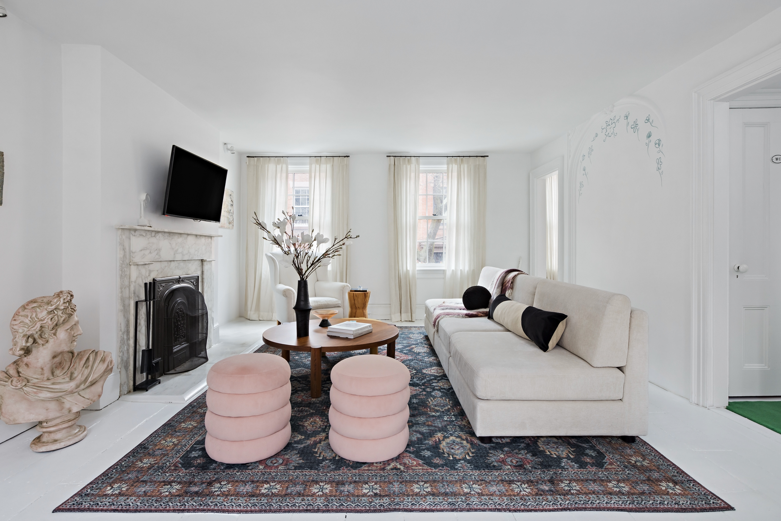 49 Barrow Street Manhattan, NY 10014 - Photo 5 of 25 a living room with furniture a fireplace and a flat screen tv