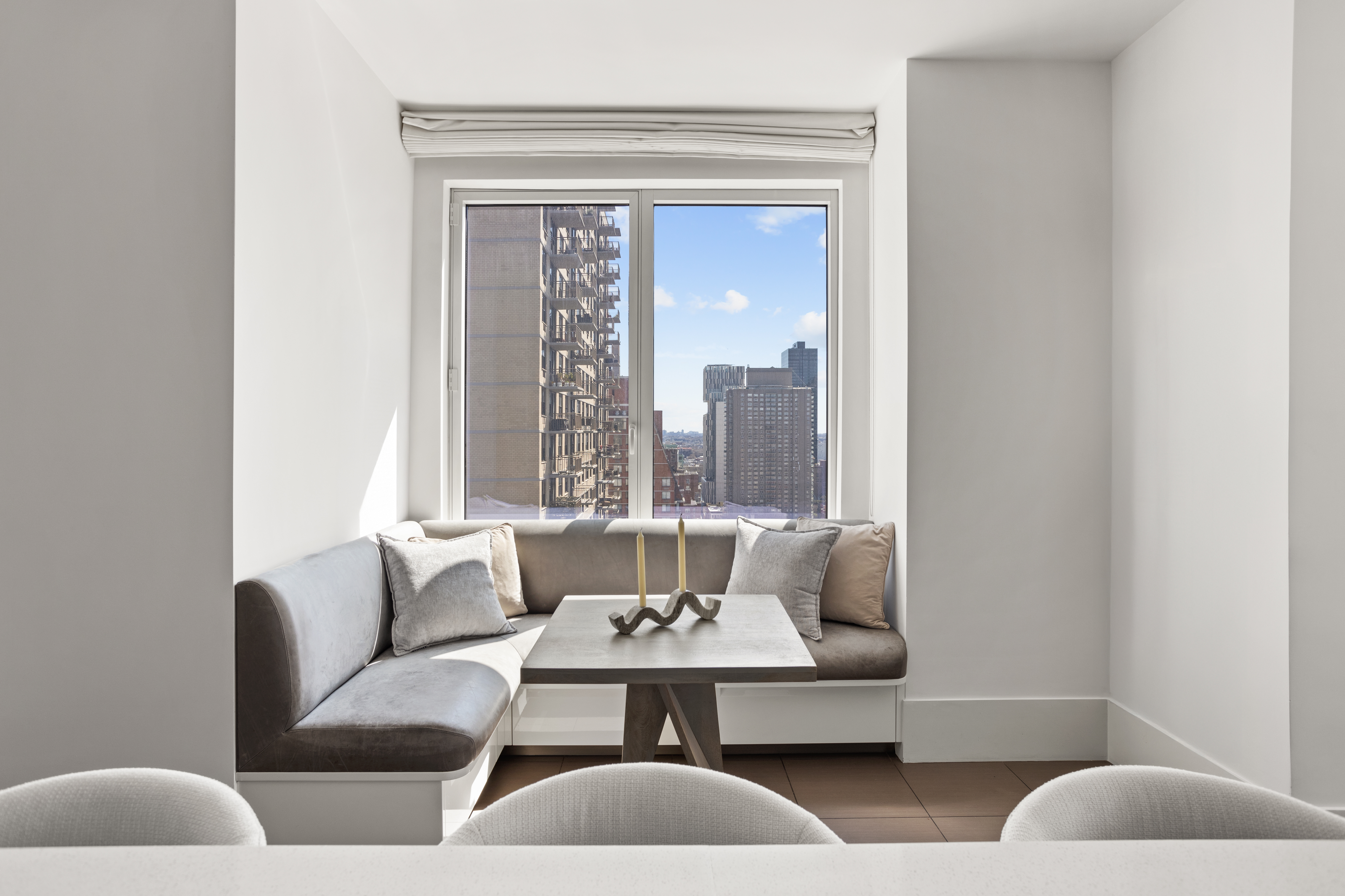 255 East 74th Street, Unit 21B Manhattan, NY 10021 - Photo 8 of 40 a living room with furniture and a potted plant