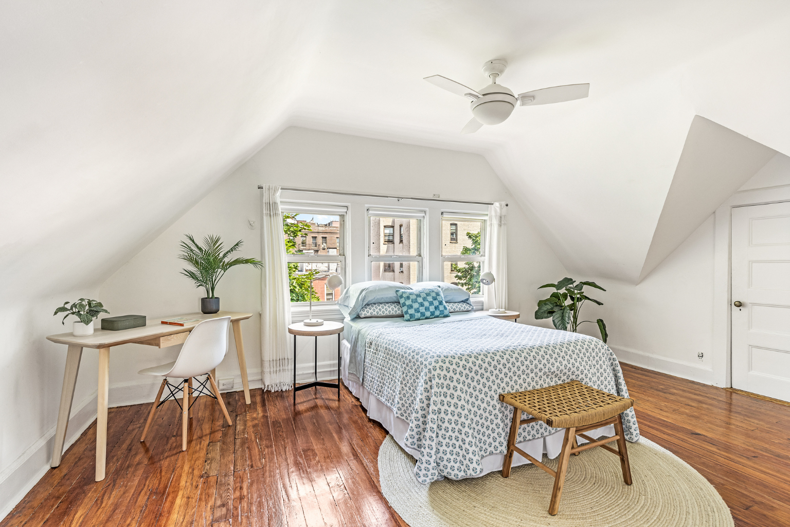 215 Marlborough Road Brooklyn, NY 11226 - Photo 14 of 21 a bedroom with a bed and a table chair