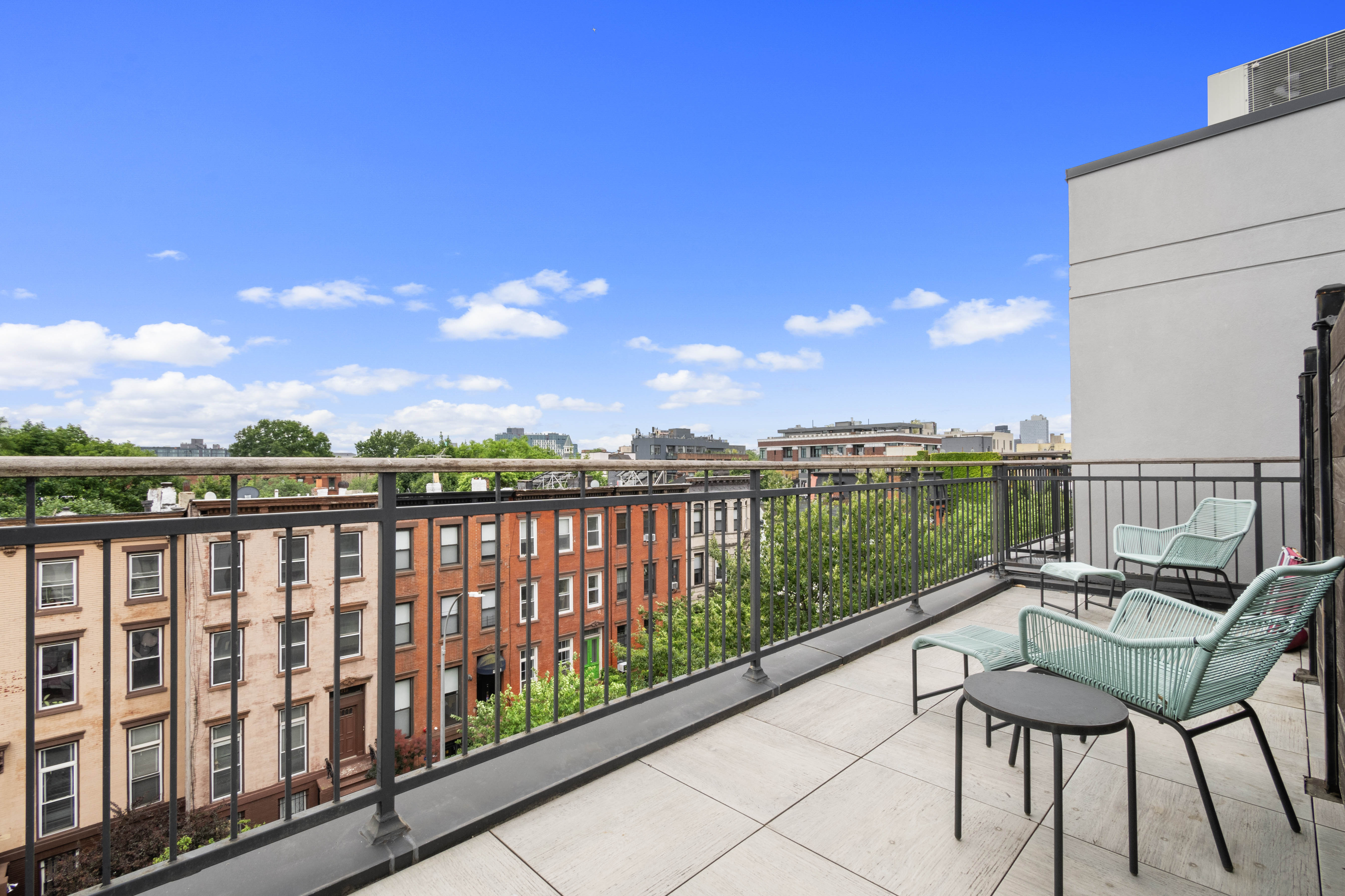 203 Quincy Street, Unit 4B Brooklyn, NY 11216 - Photo 9 of 11 a view of a chairs in a balcony