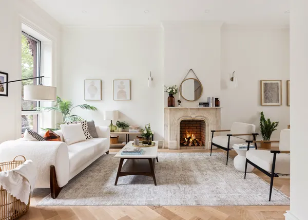 a living room with furniture and a fireplace