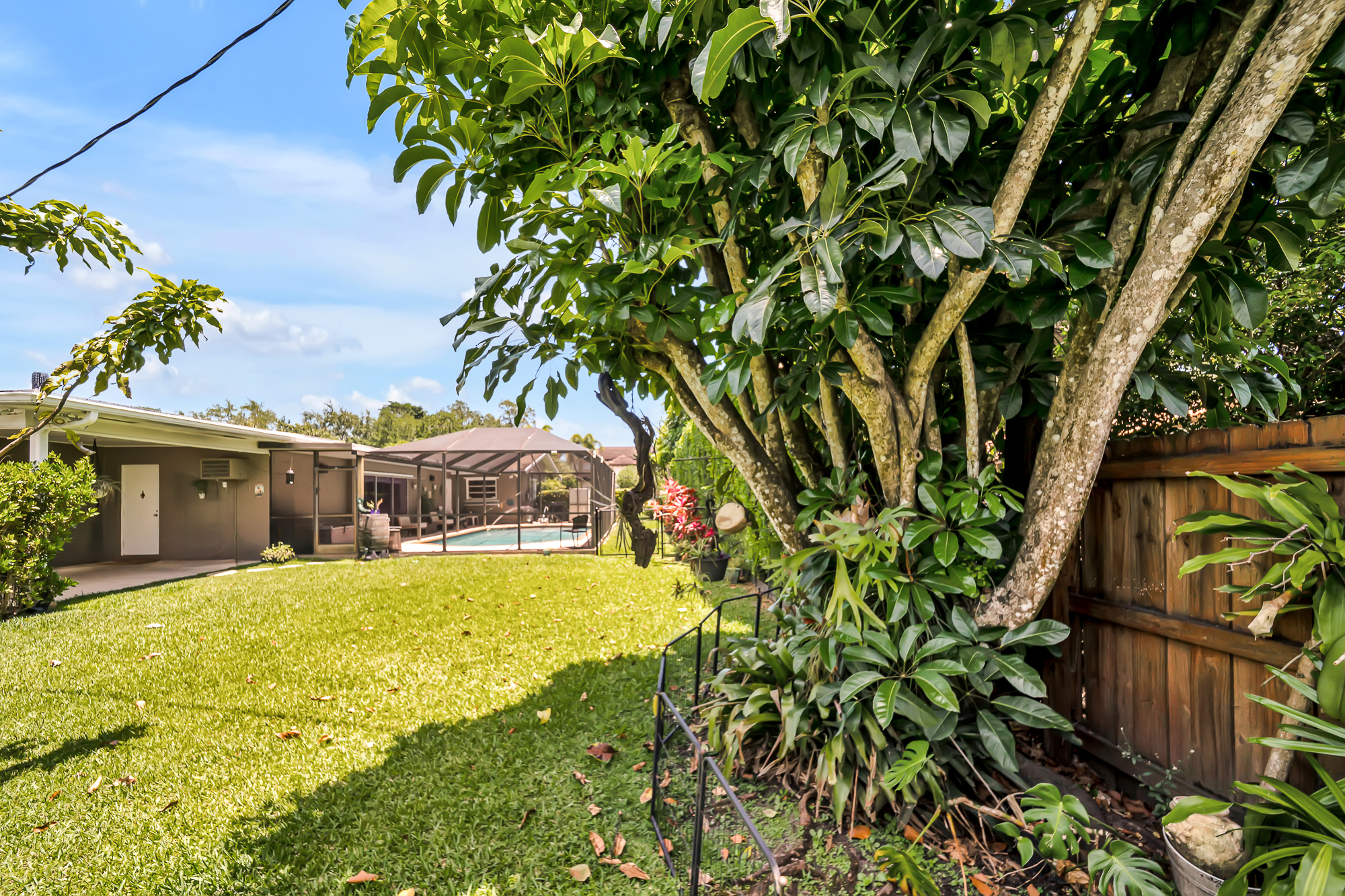 6760 Southwest 62nd Terrace Miami, FL 33143 - Photo 6 of 38 a view of a house with a yard