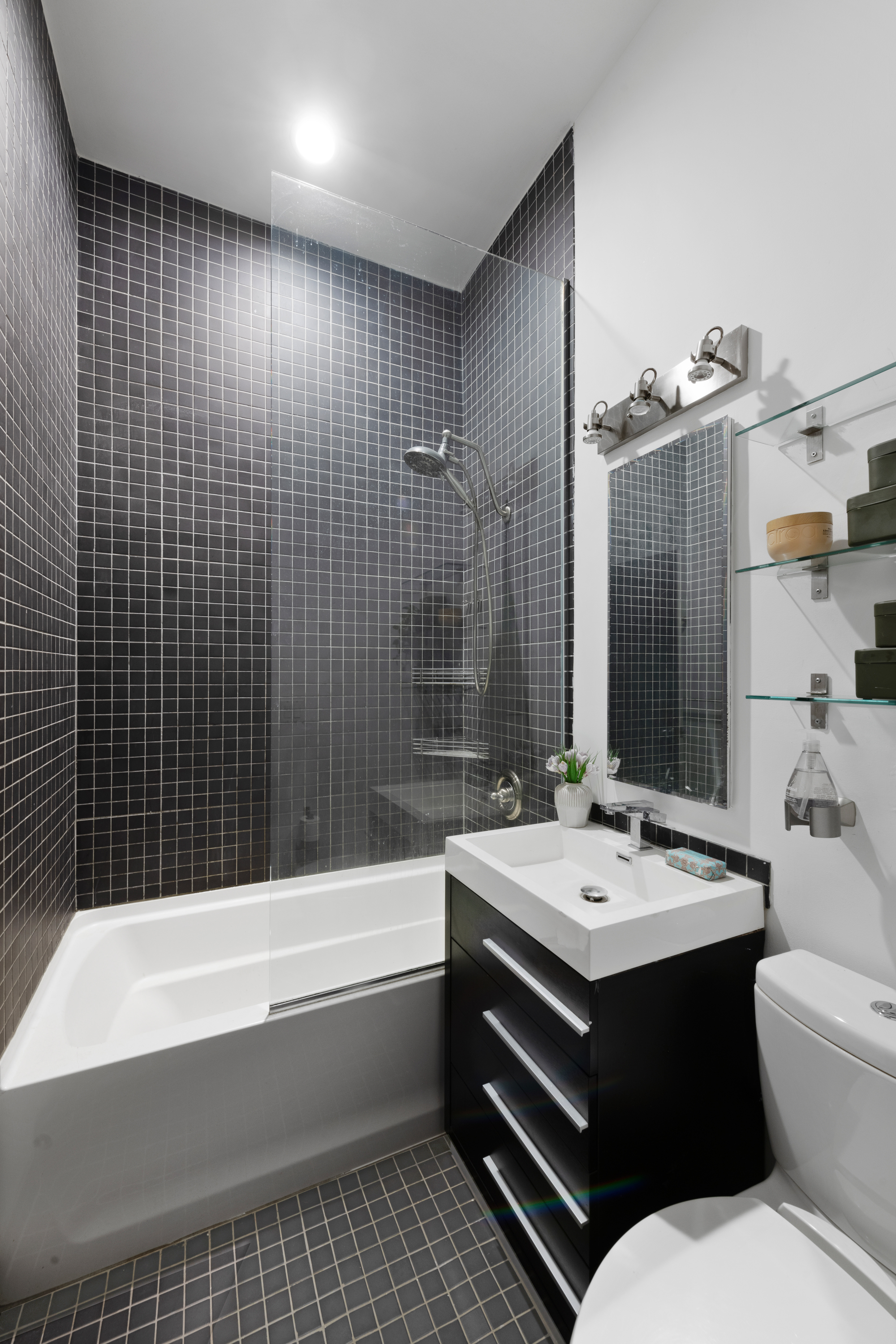 689 Fort Washington Avenue, Unit M2 Manhattan, NY 10040 - Photo 8 of 9 a bathroom with a sink a toilet and shower