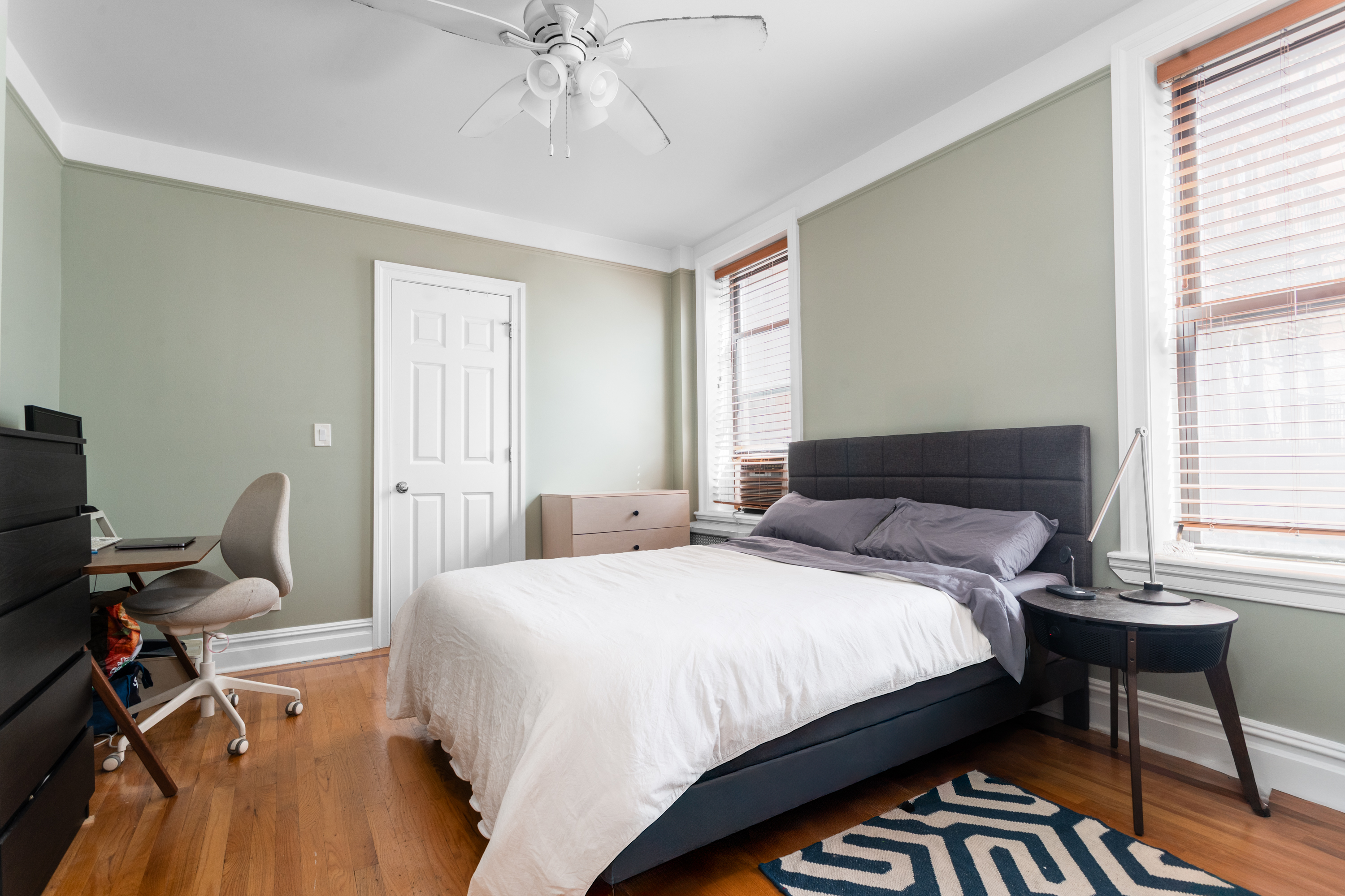 750 Riverside Drive, Unit 4E Manhattan, NY 10031 - Photo 7 of 11 a bedroom with a bed and a window