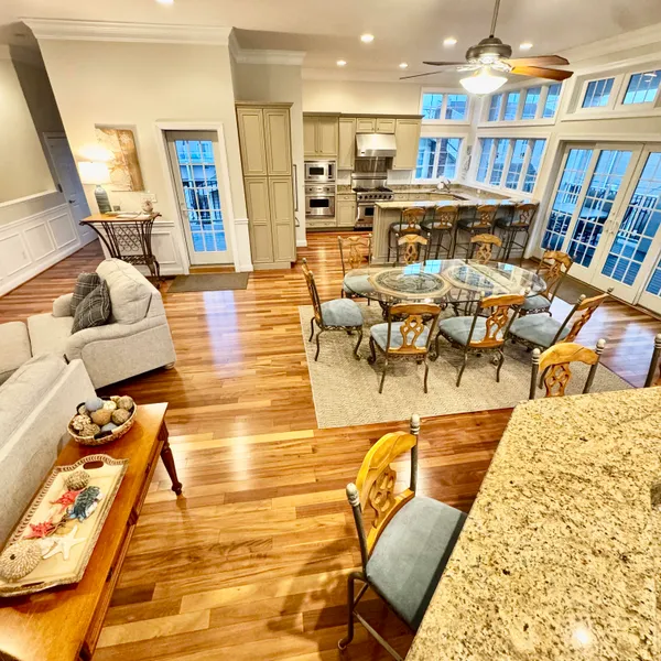 a living room with lots of furniture and a book shelf