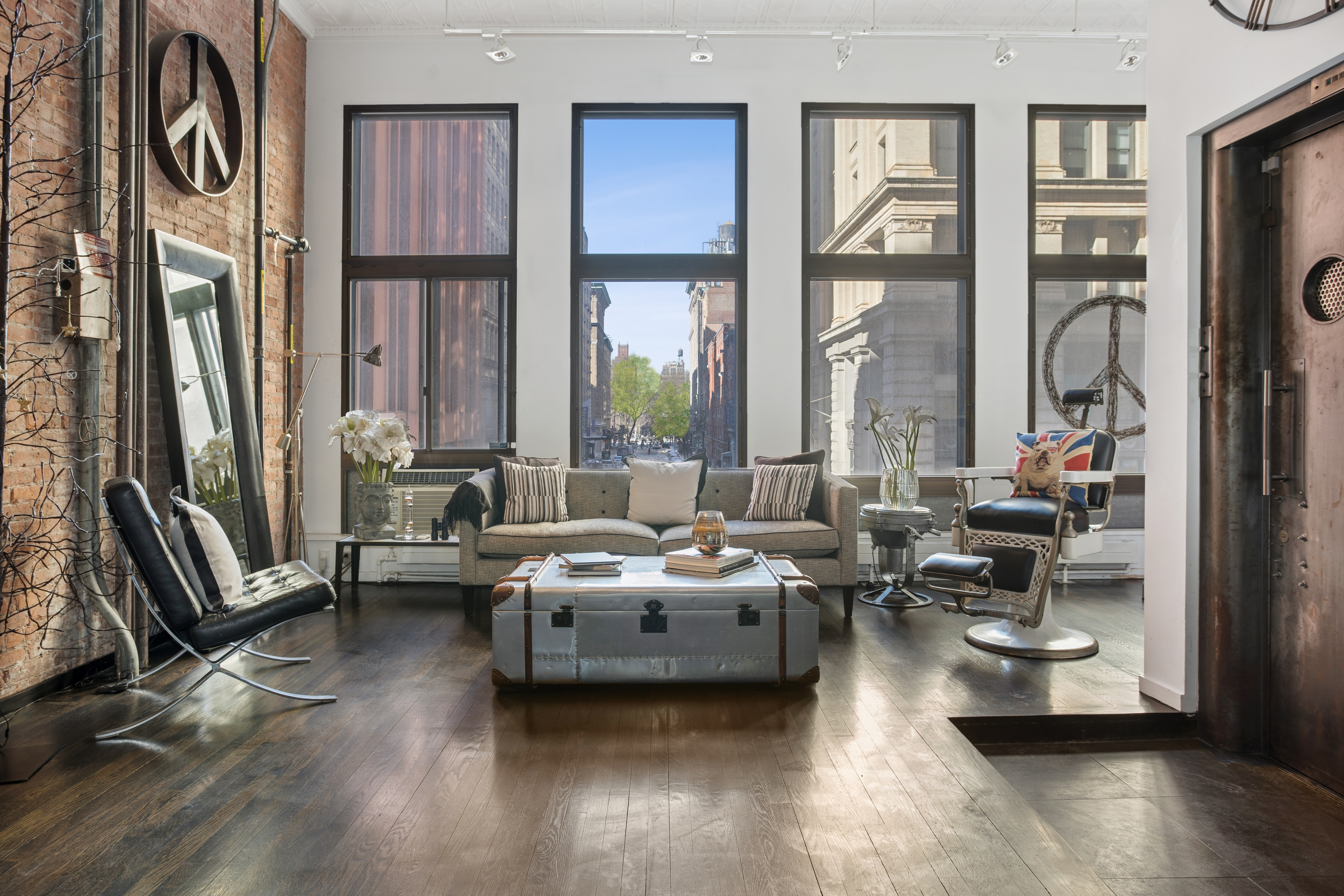 a living room with furniture window and wooden floor