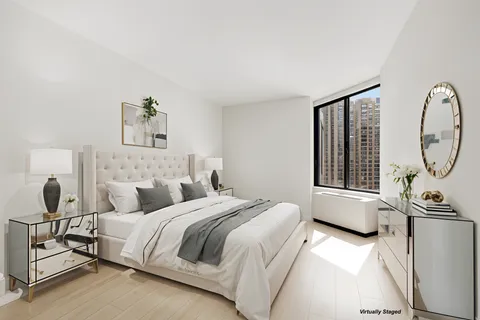 a bedroom with bed and a window