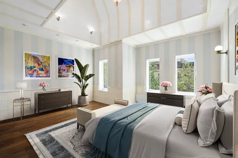 a bedroom with a bed and a couch