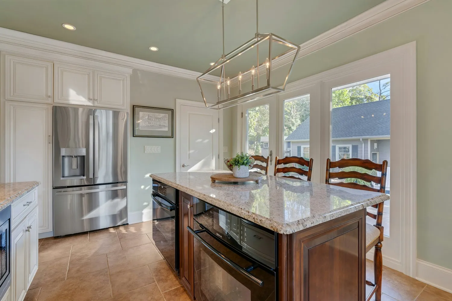 a dining room with furniture a chandelier and wooden floor