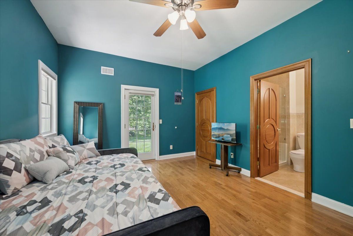 a kitchen with stainless steel appliances granite countertop a sink a oven and a refrigerator