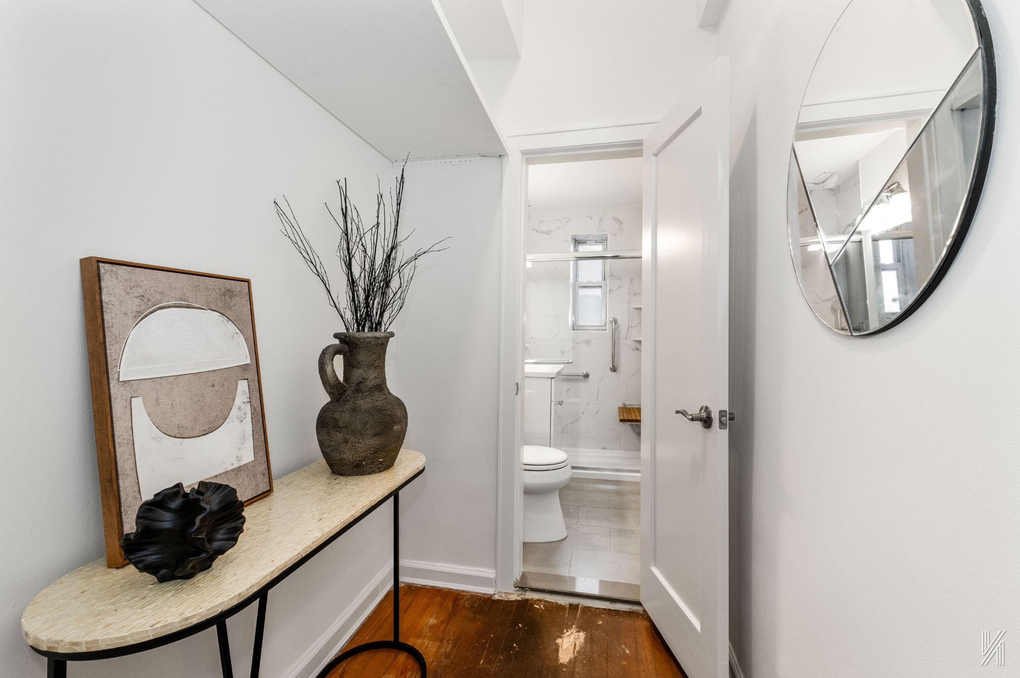 39-30 52nd Street, Unit GA Queens, NY 11377 - Photo 10 of 15 a bathroom with a toilet and a mirror